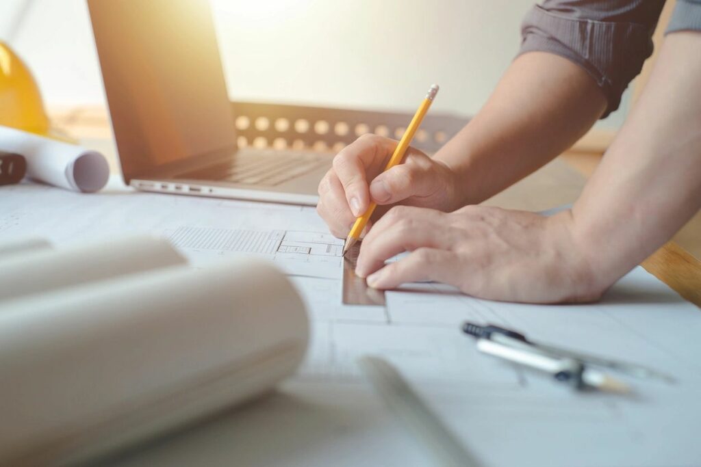 A person working on a draft floor plan